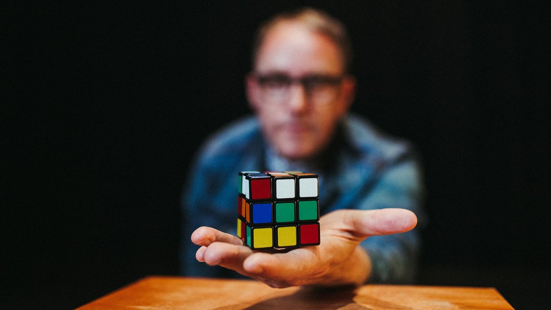 bro holding a rubicks cube