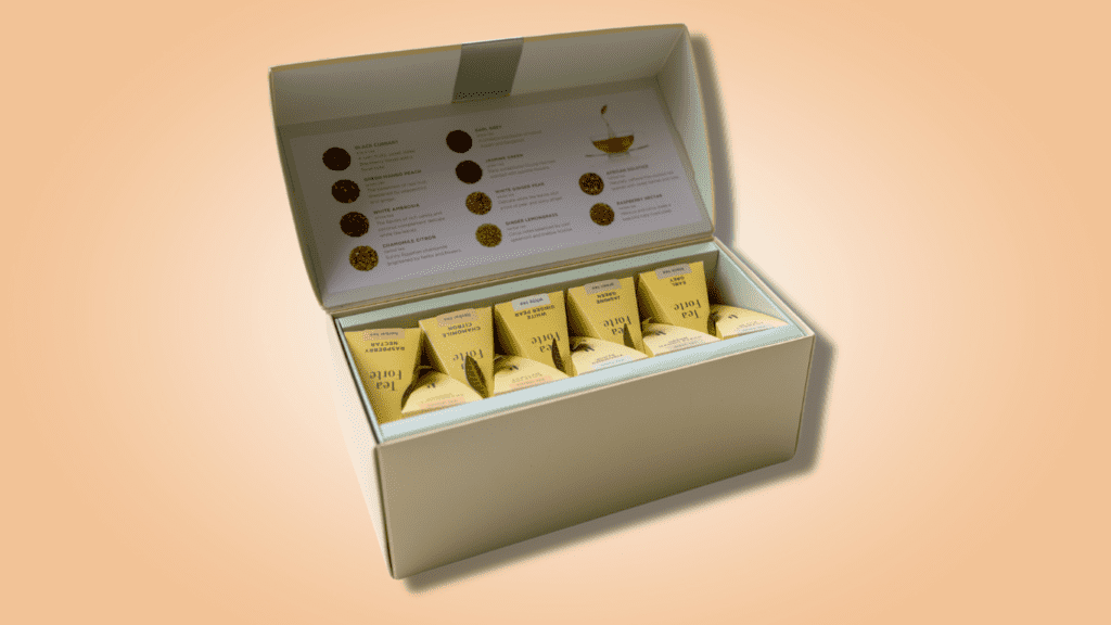 Box of Tea used in tea tasting events on peach background