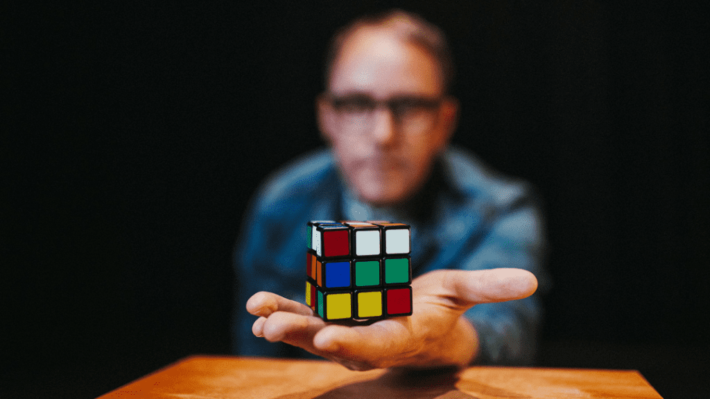 Magician Justin 'Bro' Gilbert holding a Rubix Cube