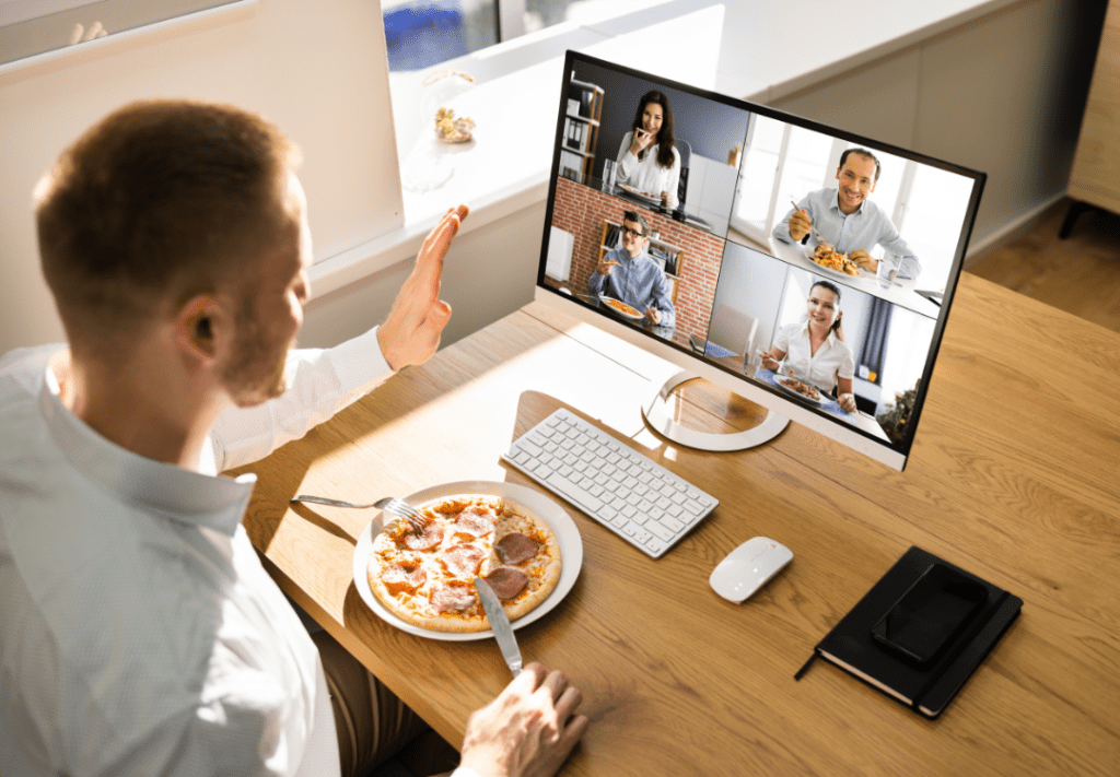 Virtual Lunch man sitting with pizza at computer