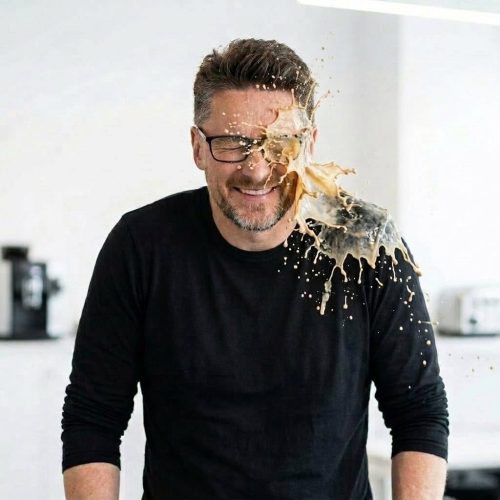 A man having a latte thrown at him